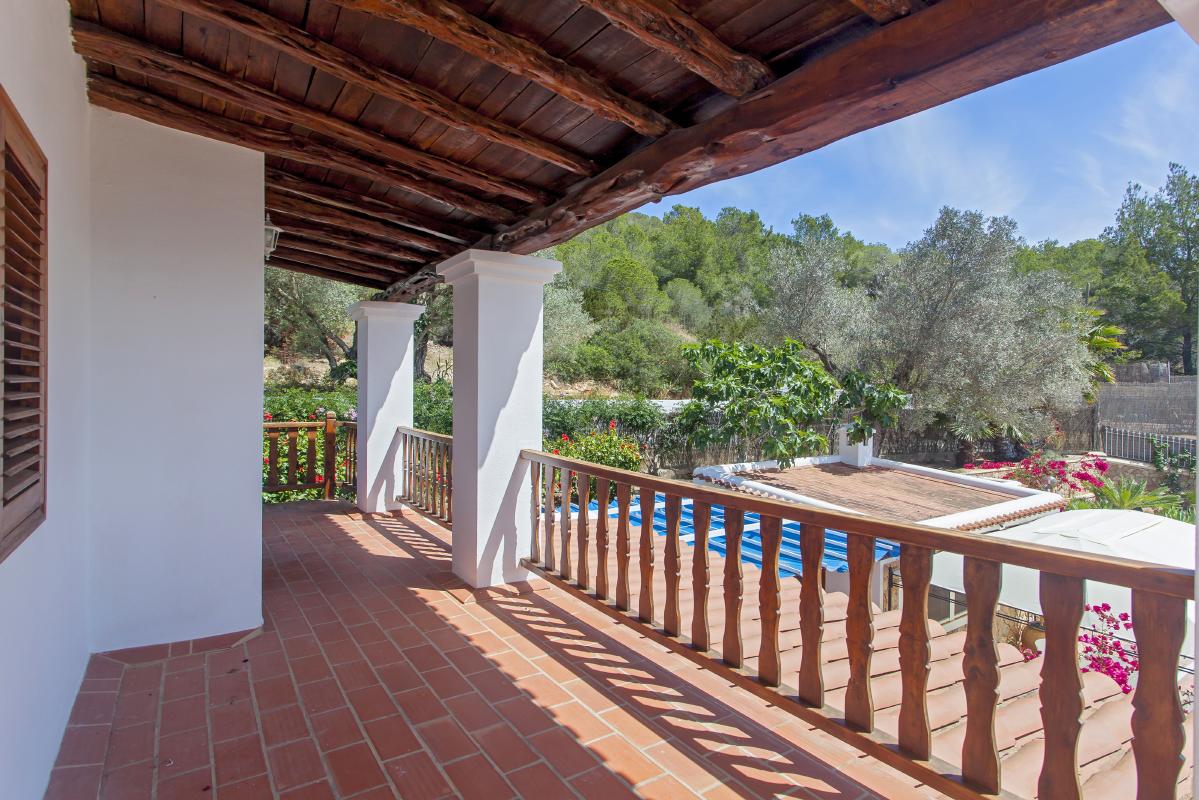 Large terrace with wooden ceilings and incredible views to the garden and pool